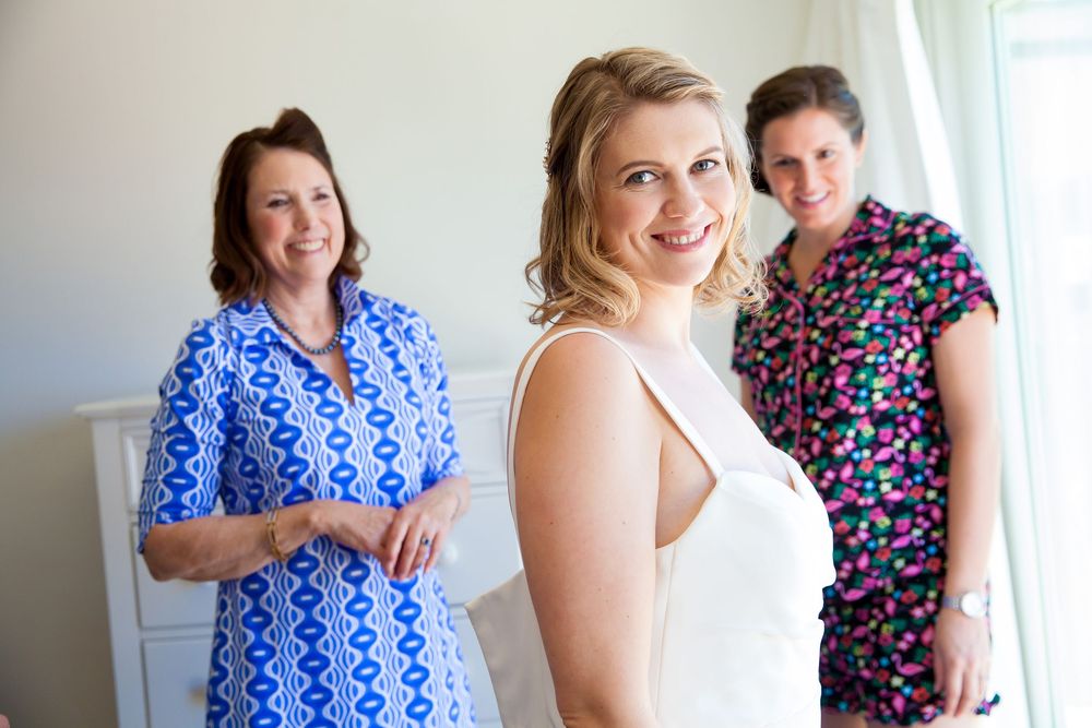 Wedding preparation scene in a bright interior room.