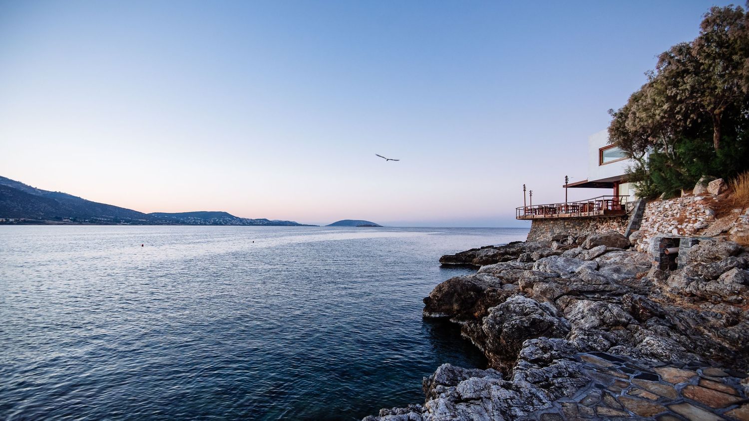 Panoramic seascape showing calm waters and distant islands.