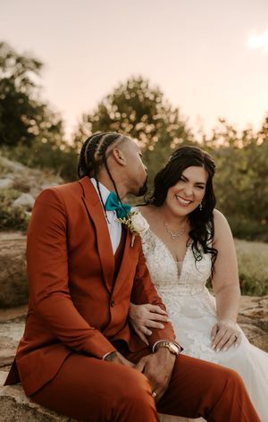 Joyful wedding moment captured during golden hour outdoor photoshoot.