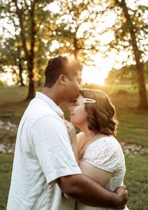 Sunset photo sequence of an intimate embrace in a grassy field.