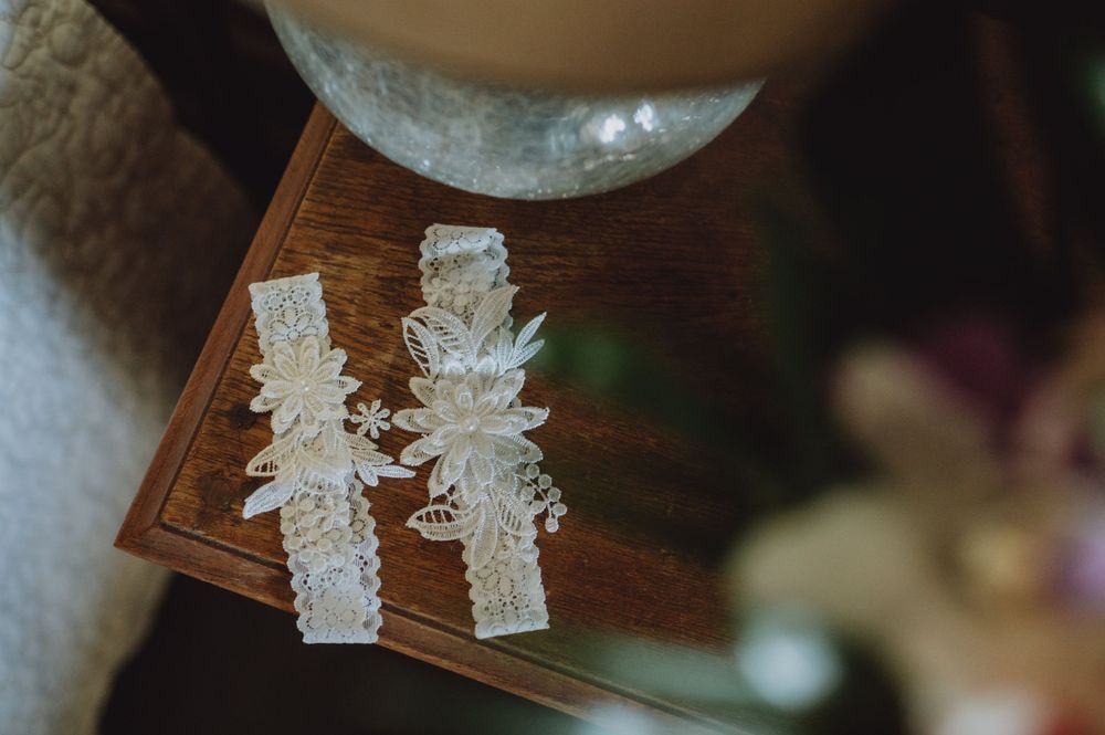 Close-up detail of delicate lace wedding dress accessories.
