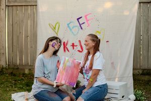 Four connected photos show people enjoying drinks and conversation in a backyard setting with a wooden fence.