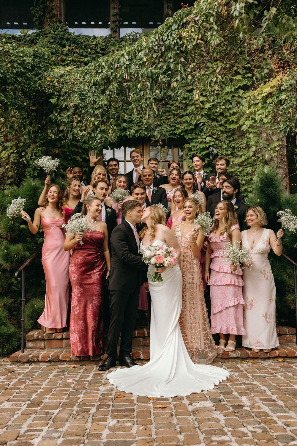 A photograph of a wedding party standing on the steps at an Atlanta wedding venue