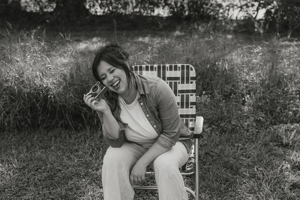 Black and white photo series showing someone in a white shirt taking photos with a vintage instant camera.