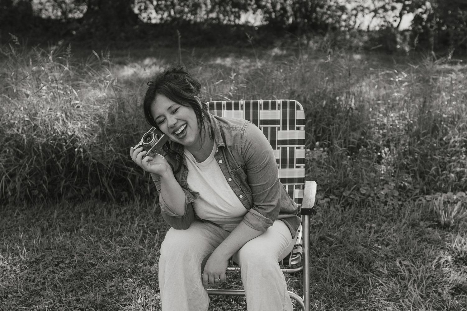 Black and white photo series showing someone in a white shirt taking photos with a vintage instant camera.