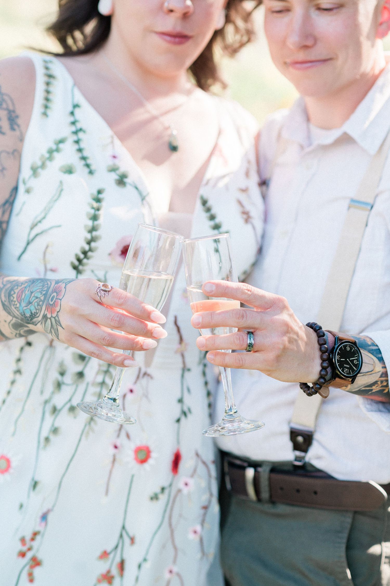 Close-up showing hands toasting champagne