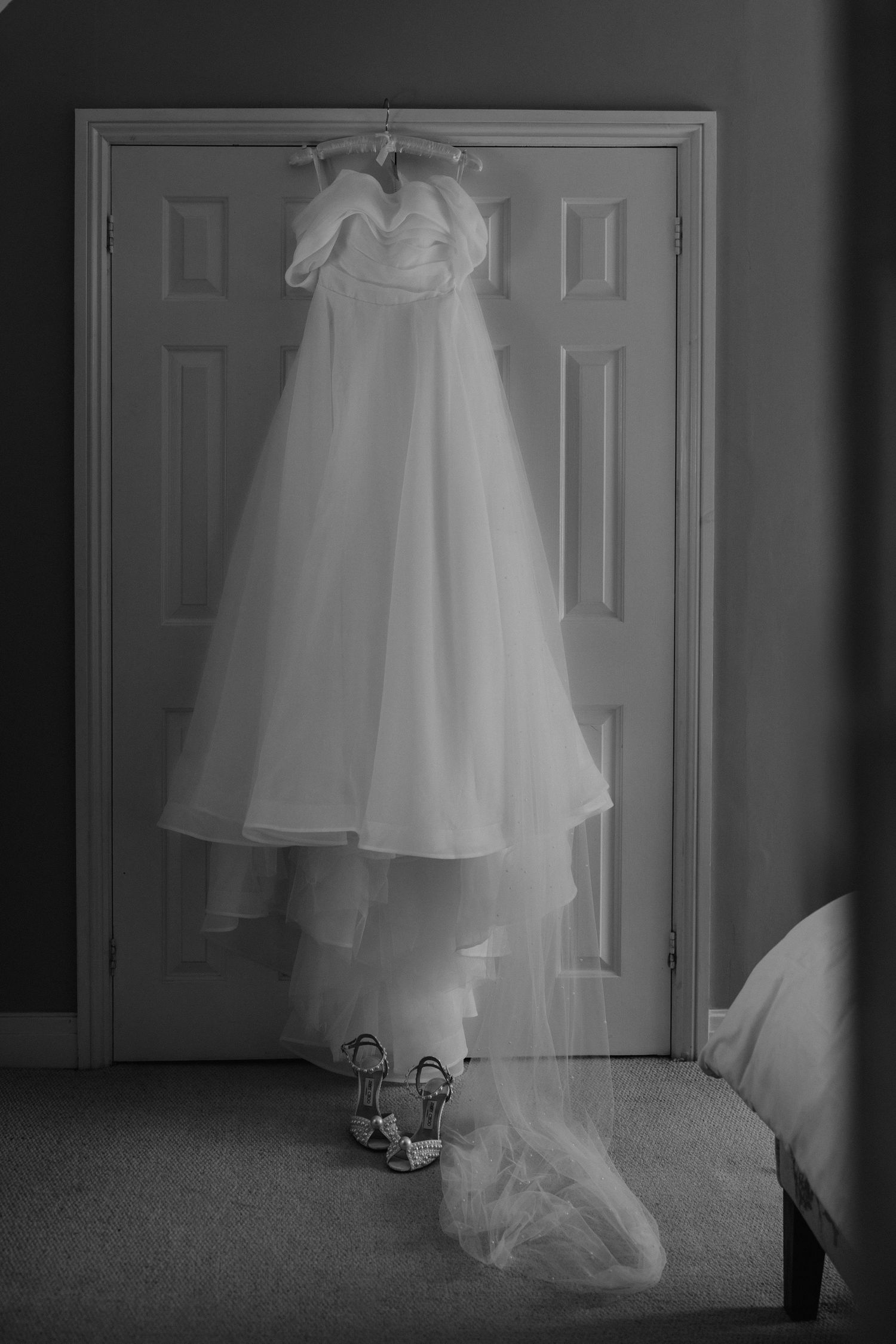 wedding dress hung up in bridal prep at a wedding in Cirencester