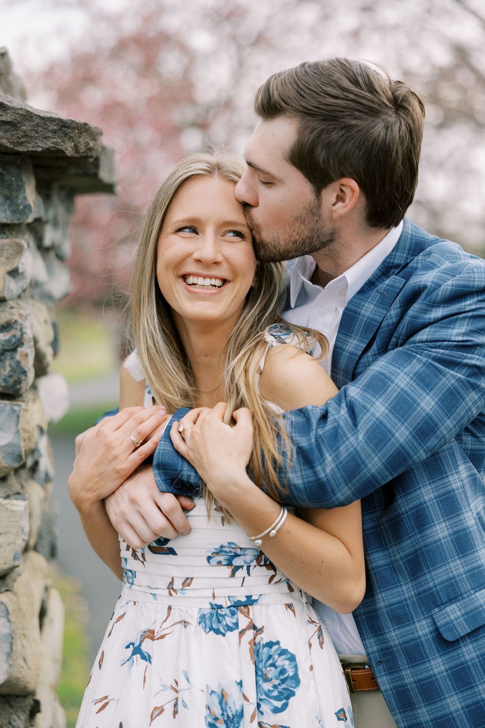 Danny and Bryn’s springtime engagement session in Warwick, NY included a few spring showers, blooming flowers, fresh greenery, and a sunset.