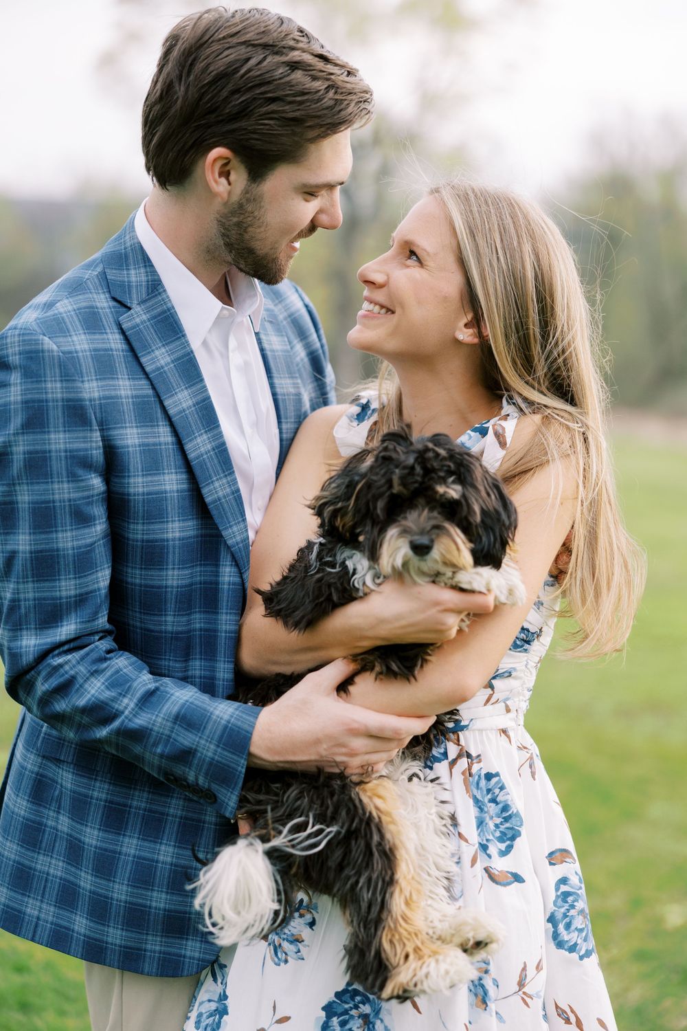Danny and Bryn’s springtime engagement session in Warwick, NY included a few spring showers, blooming flowers, fresh greenery, and a sunset.