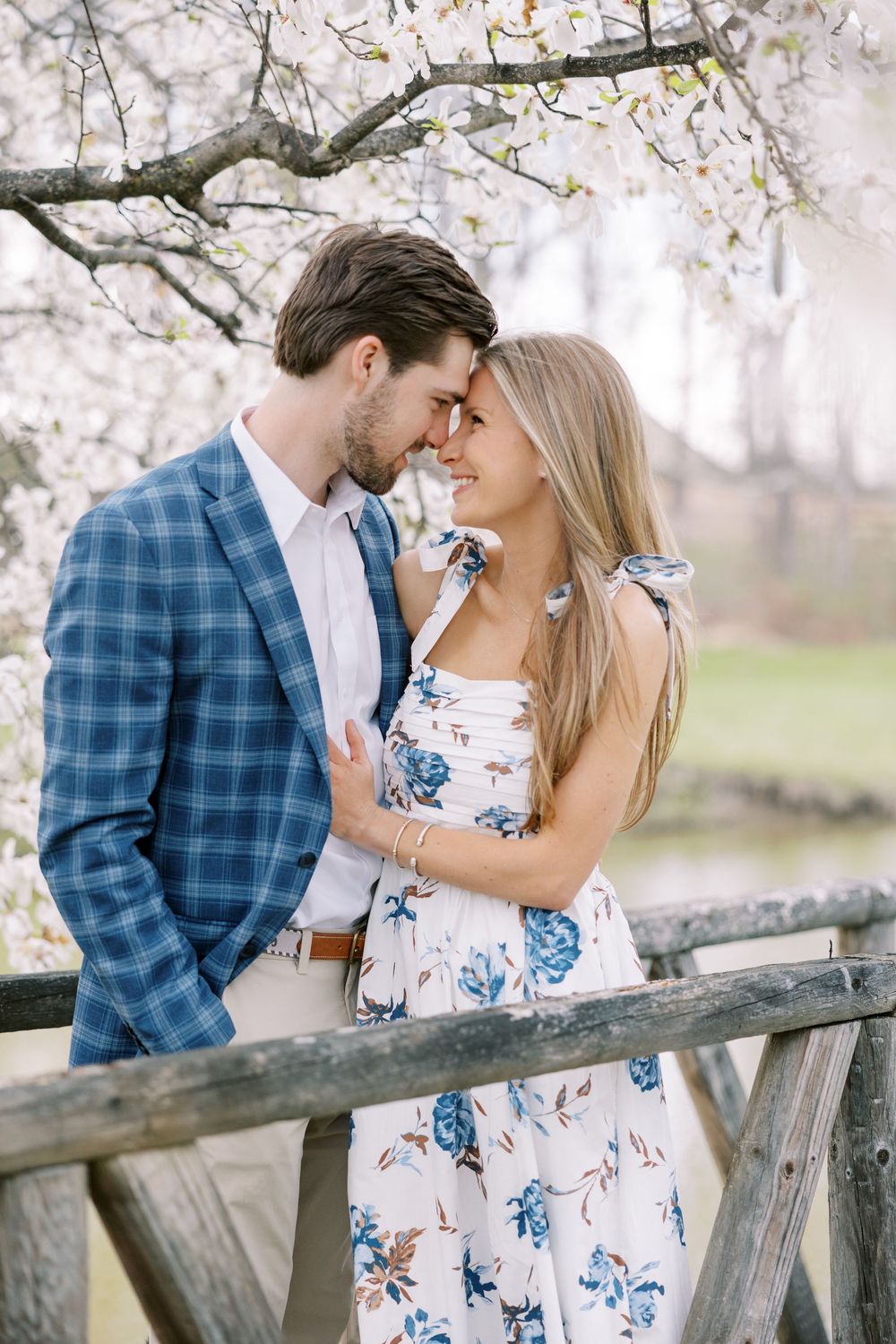 Danny and Bryn’s springtime engagement session in Warwick, NY included a few spring showers, blooming flowers, fresh greenery, and a sunset.