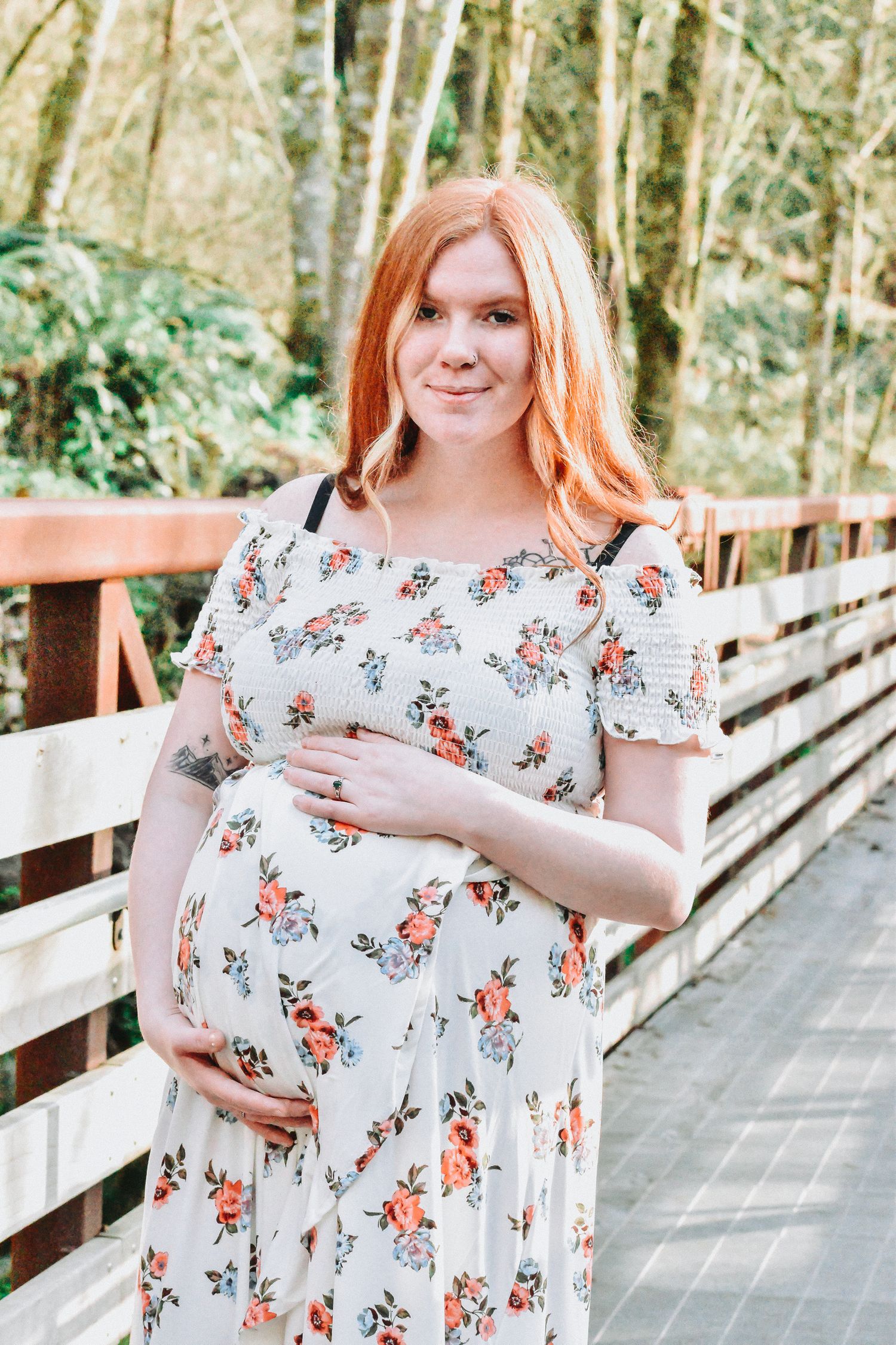 Maternity photo on a wooded boardwalk—peaceful and radiant spring pregnancy portrait in the Seattle and Tacoma area.