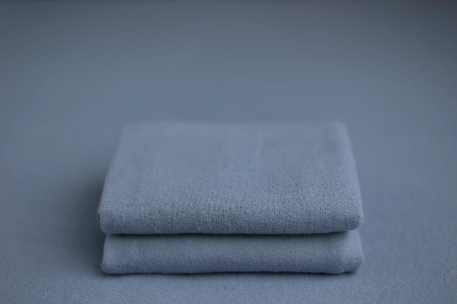 Soft dusty blue backdrop and wrap color