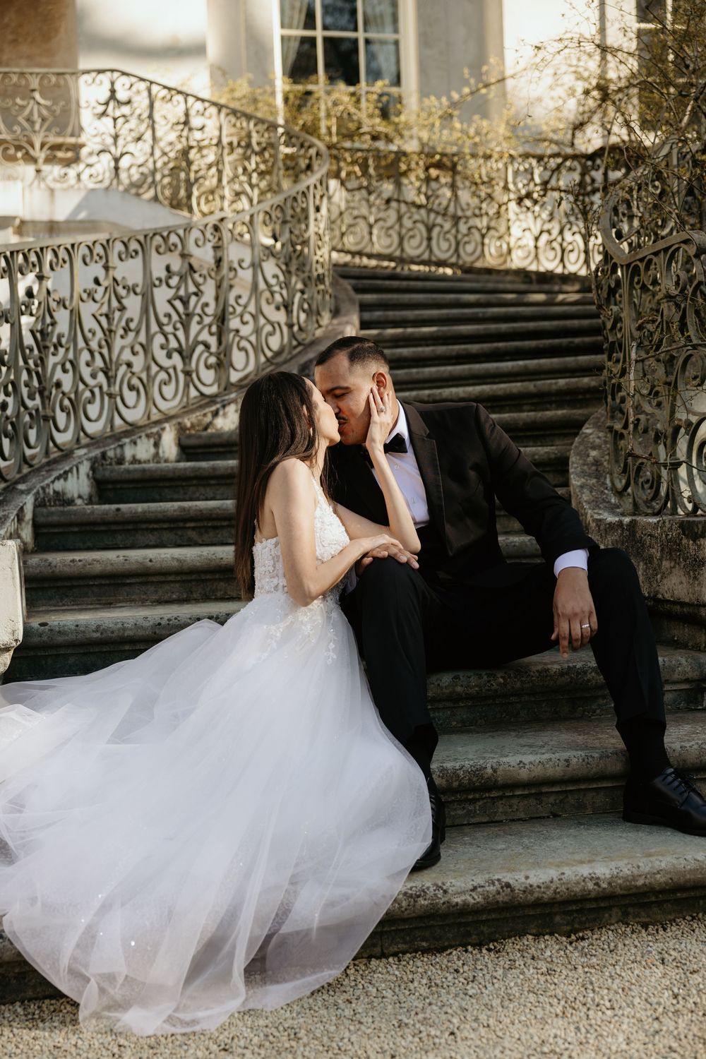 Bride and groom on the staircase of the Swan House in Atlanta, GA.