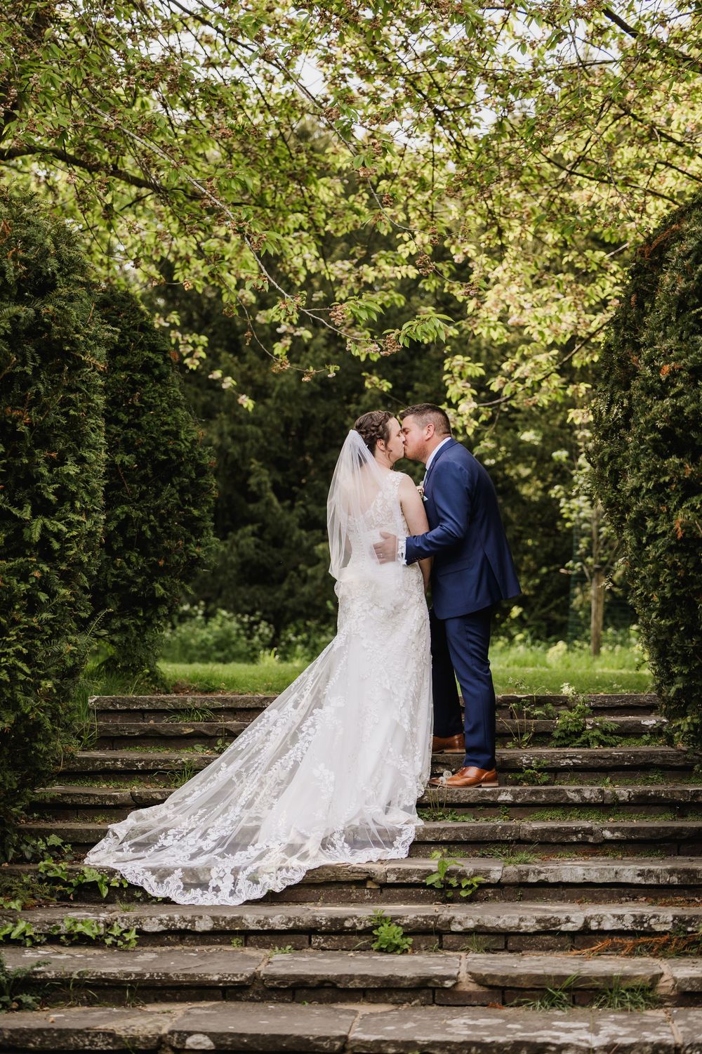 Wedding couple with long train at Gildredge Manor