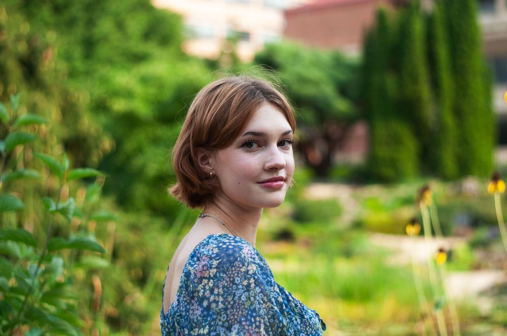 A portrait of a senior girl in a garden