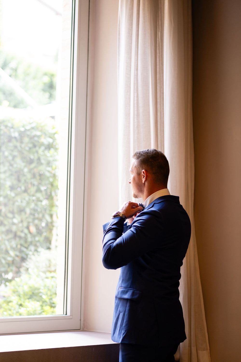 Groom getting ready at Nun Relais — timeless Italian elegance for destination weddings.