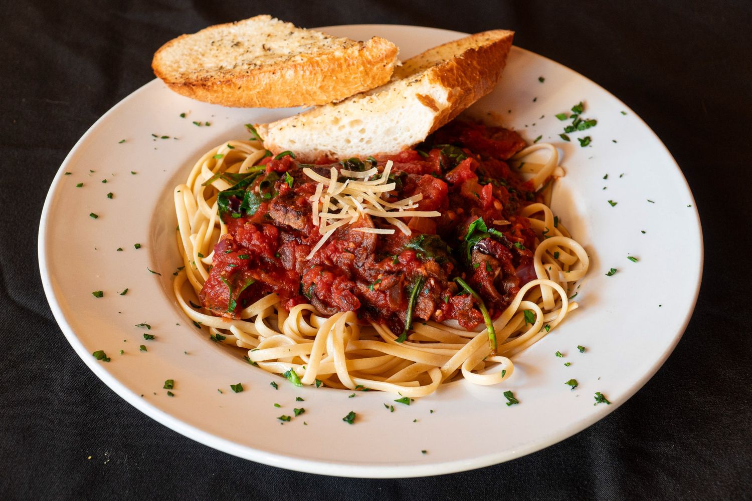 Close-up shots of pasta dishes with meat sauce and garnishes on white plates arranged in a horizontal sequence.