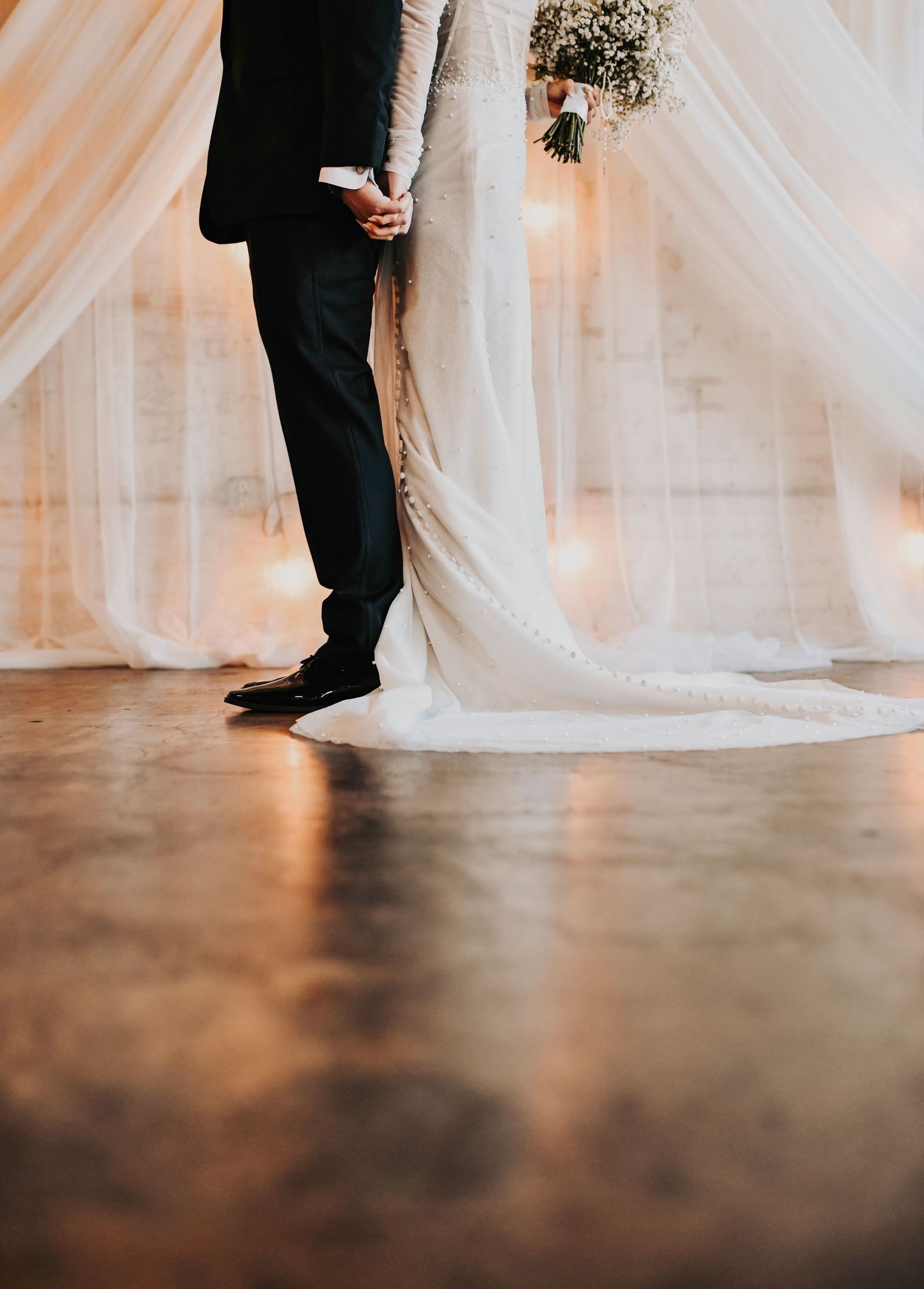 Emotional pre-ceremony prayer as the bride and groom share a quiet moment with God at their modern Dallas wedding