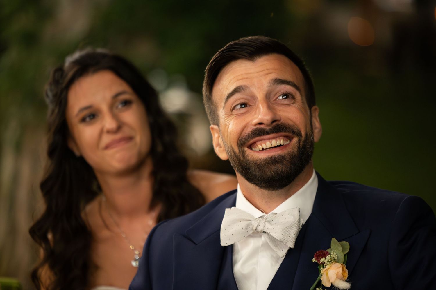 Candid moments captured during an outdoor wedding celebration in natural lighting.