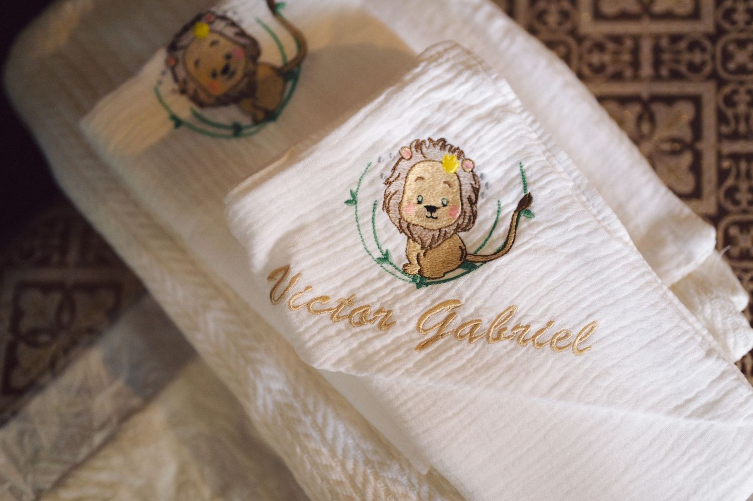 Embroidered white baptismal towel with cute angel designs.