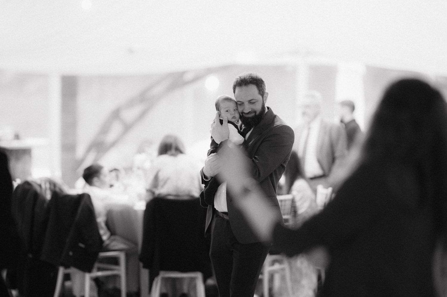 A photographer captures an intimate moment at a formal event.