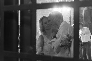 Black and white photographs showing intimate moments of affection between couples in various settings.