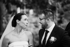 A black and white wedding photo sequence showing a couple in formal attire outdoors.