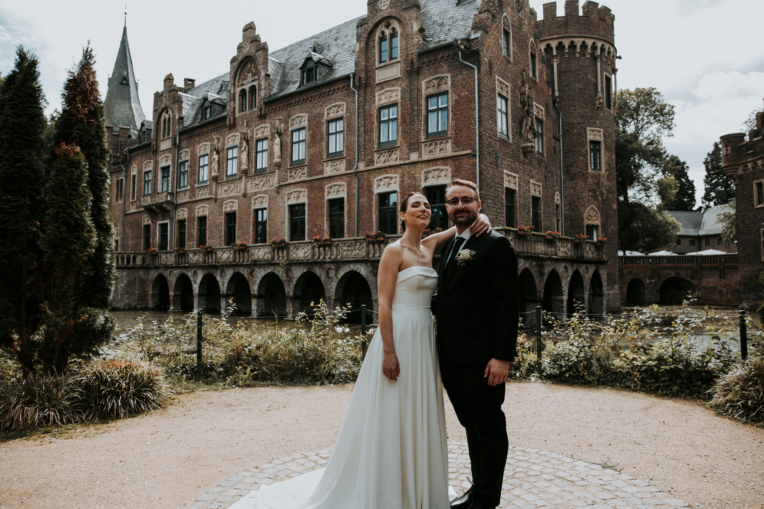 Gothic castle architecture provides a stunning backdrop for a wedding celebration.