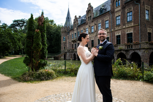 Elegant wedding photography session on the grounds of a historic castle estate.