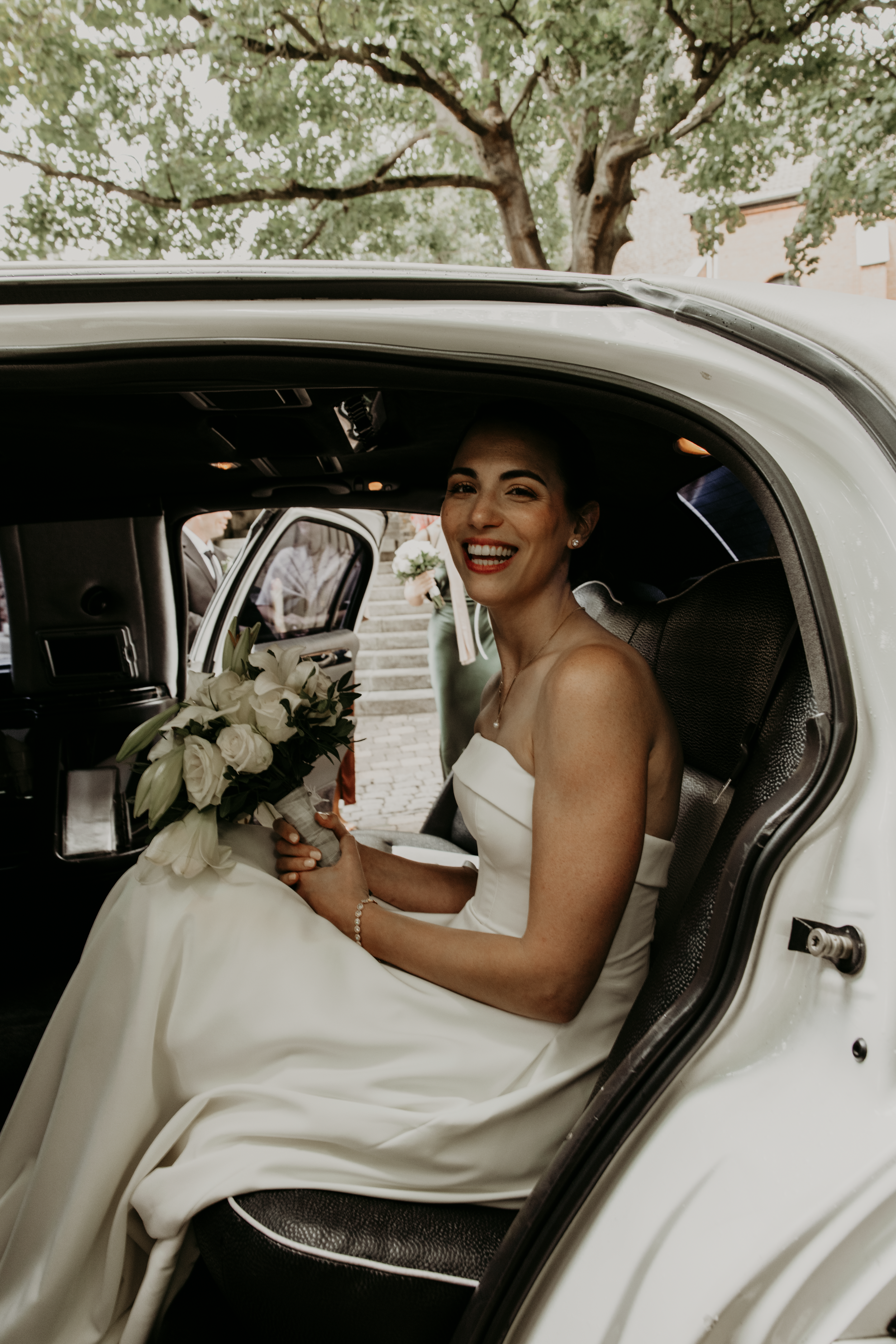 A sequence of candid moments showing joyful laughter inside a white luxury car on a special occasion.