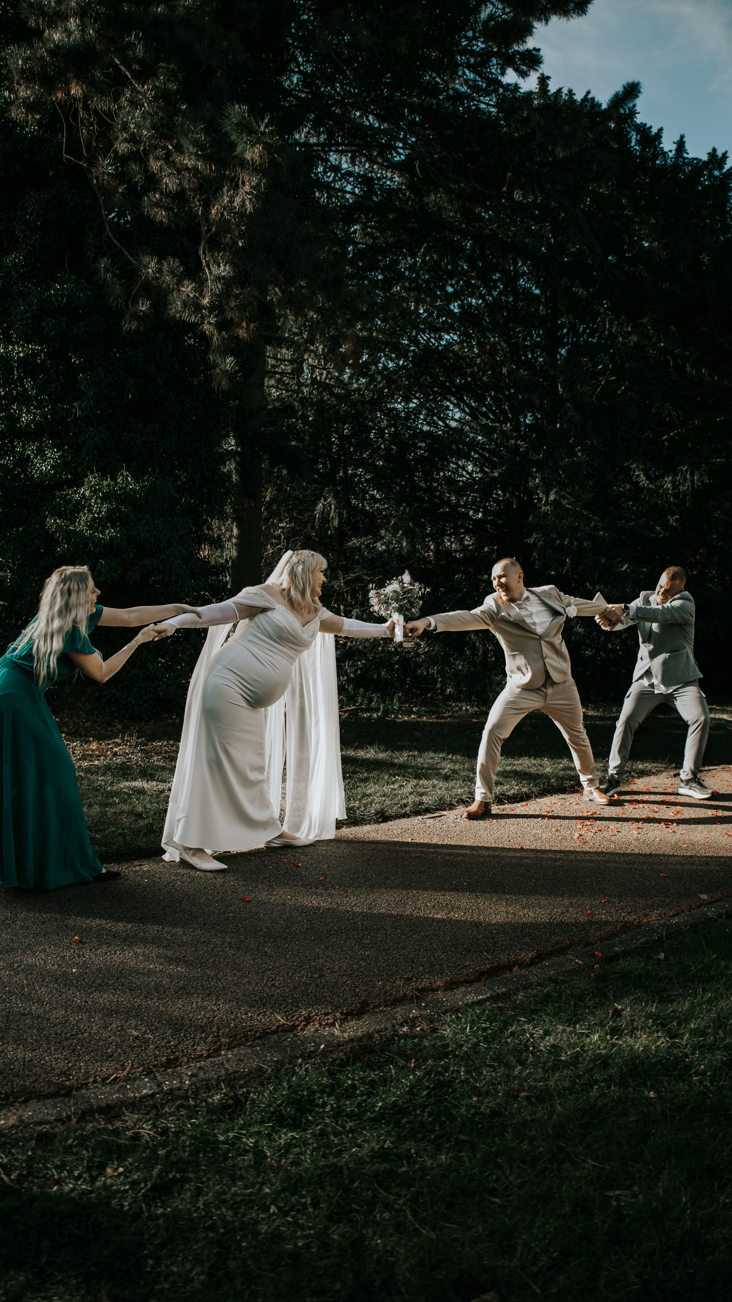 A dramatic sequence of photos showing figures in white clothing performing dynamic leaping poses in an outdoor setting.