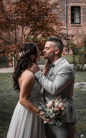 A romantic sequence of a couple sharing intimate moments during their wedding photo session against a brick building backdrop.