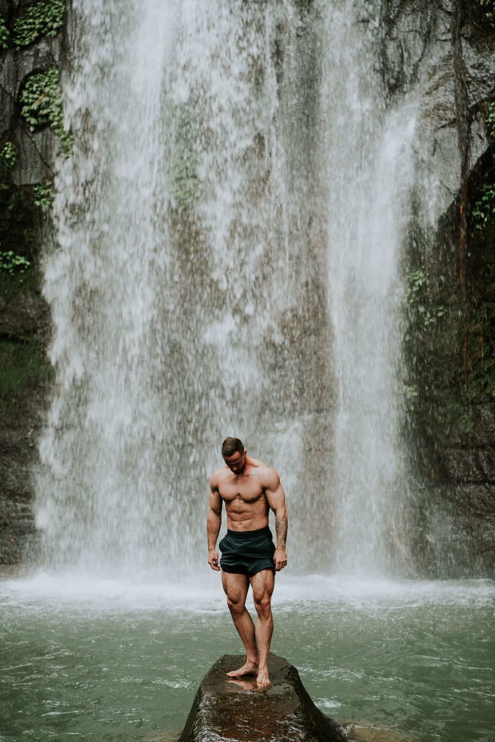 Solo portrait photography in Bali with waterfall background