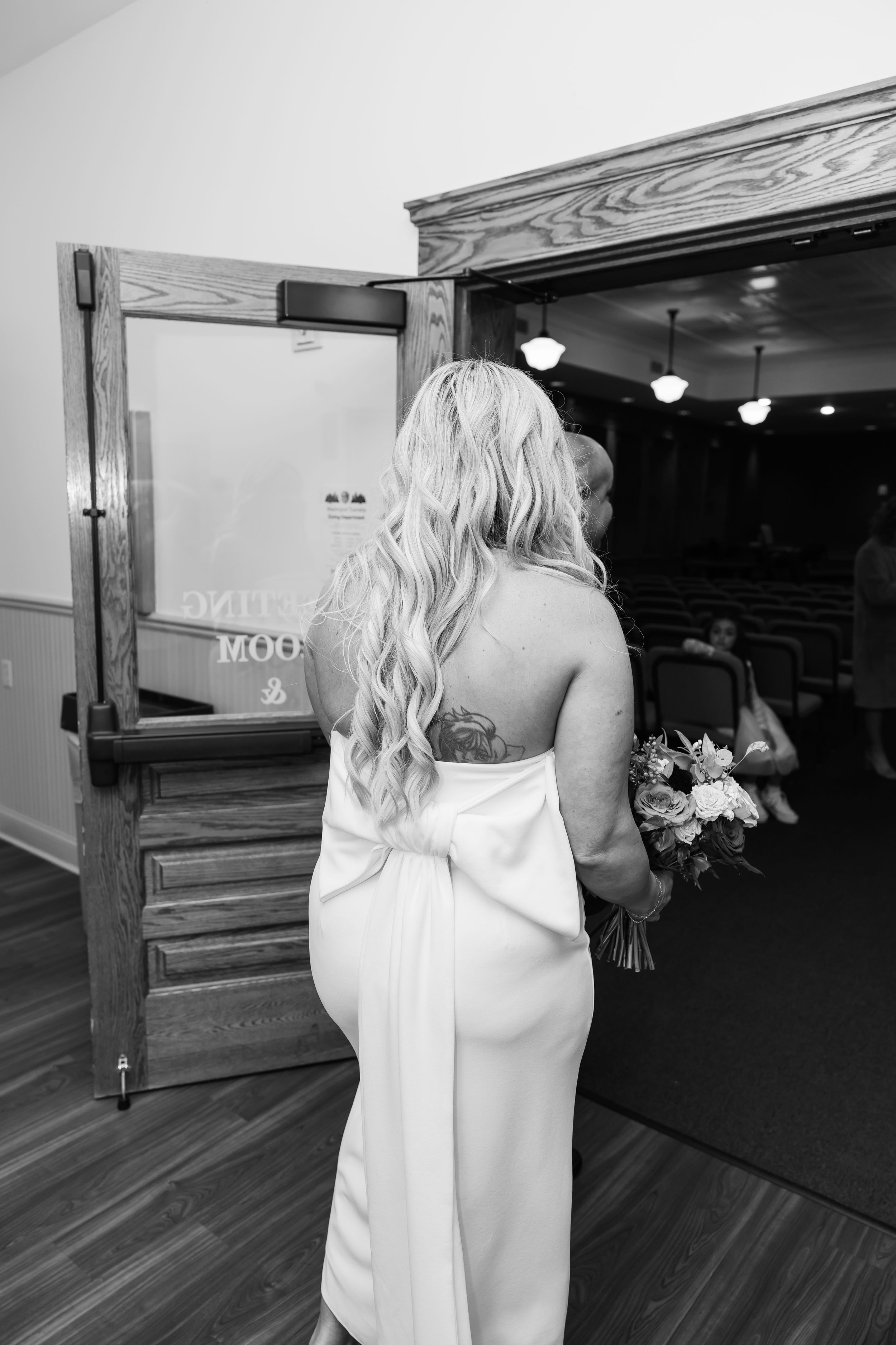 A sequence of black and white wedding photos showing a bride in a white dress walking down a church aisle.