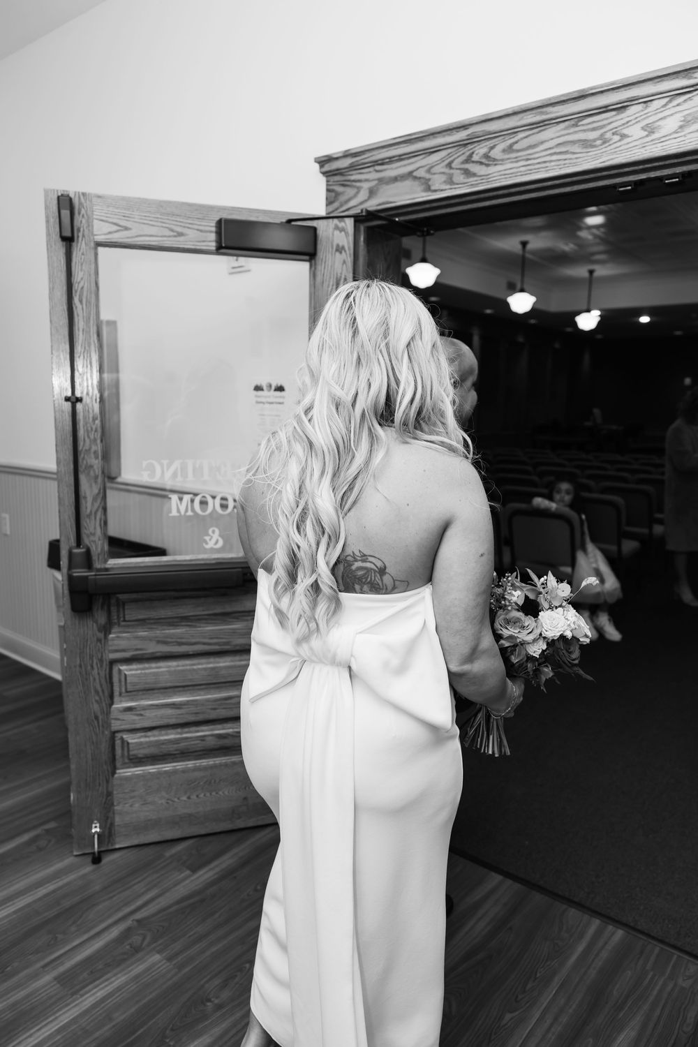 A sequence of black and white wedding photos showing a bride in a white dress walking down a church aisle.