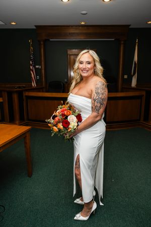 Bride holding bouquet in courthouse | small wedding photographer in New Jersey