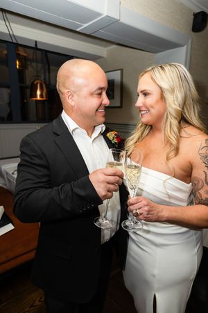 A bride groom share intimate moments while toasting with champagne glasses in a sequence of candid wedding photos. NJ wedding photographer