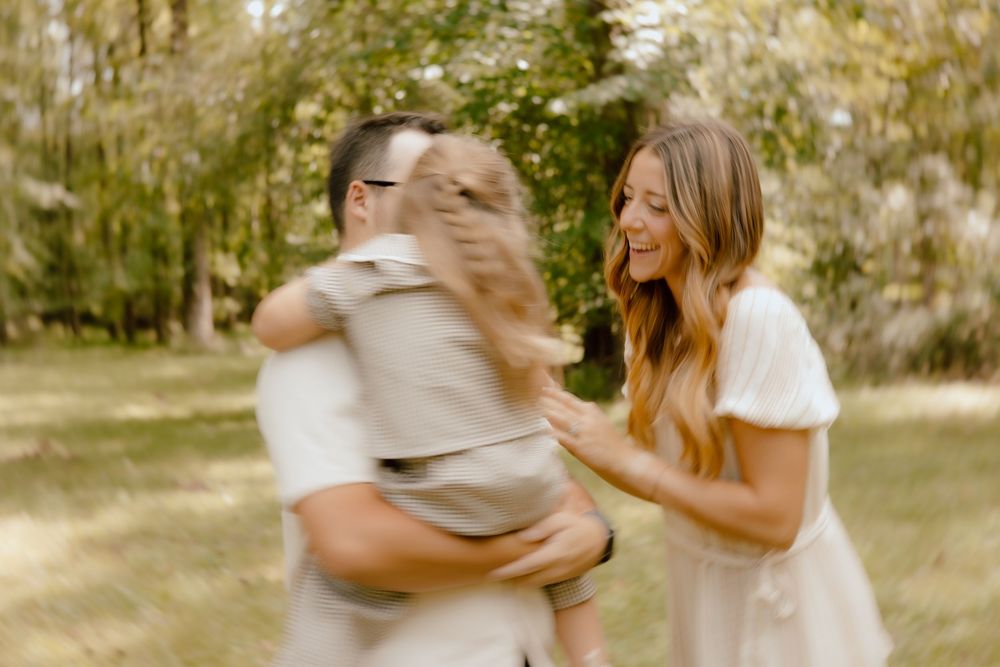 A sequence of romantic outdoor photos showing a couple embracing and dancing together in a sunlit garden setting.