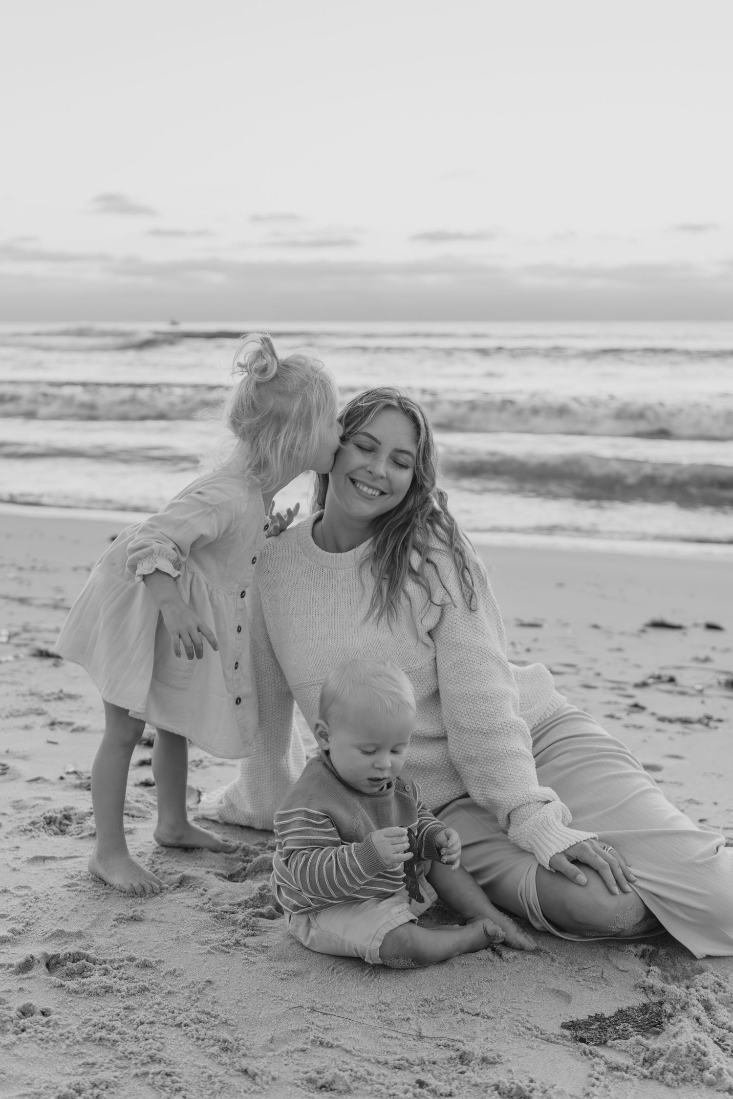 Windansea Beach family photos in San Diego with playful, candid moments by the ocean.
