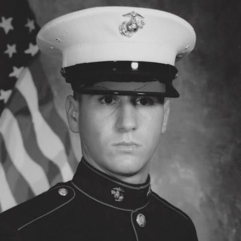 Black and white military portraits showing Marines in dress uniforms.
