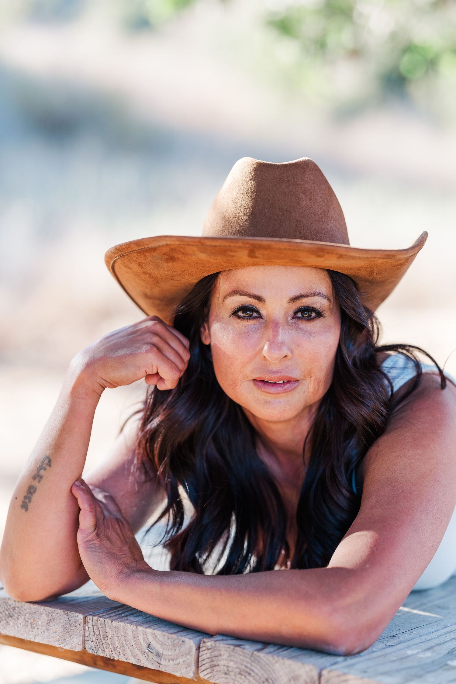 A high school senior enjoying a professional outdoor photoshoot in Simi Valley, CA, captured in soft natural light.