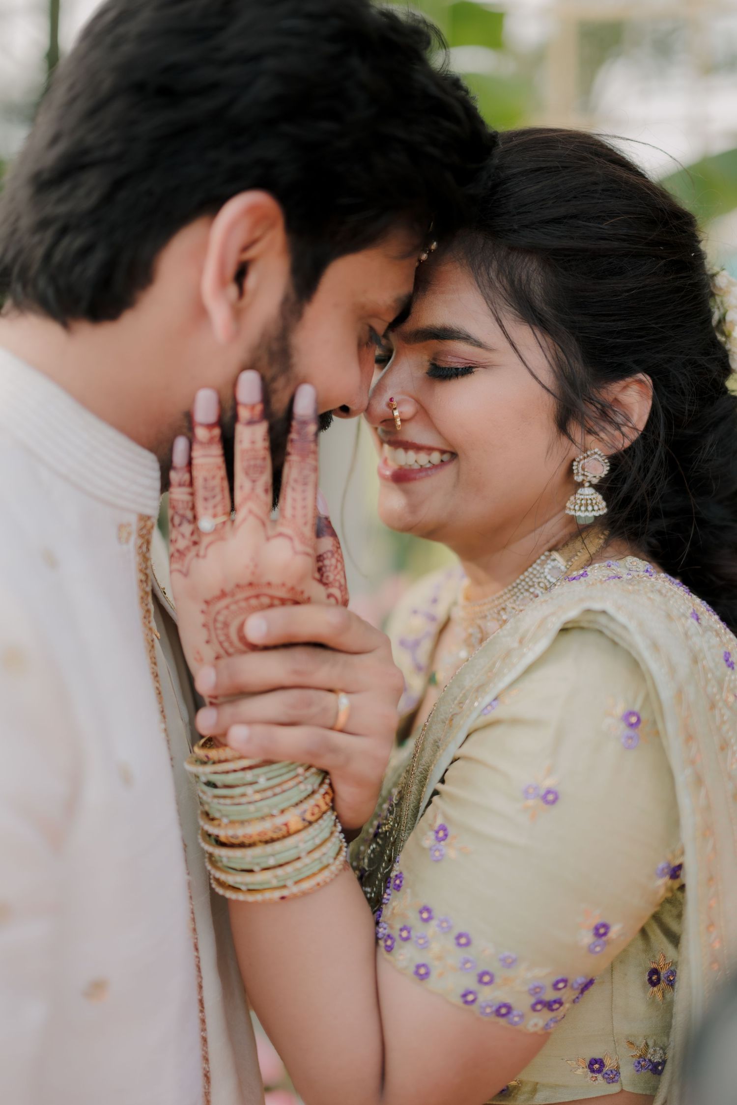 A progression of romantic intimate moment showing purple embellished light yellow outfit with bangles and smiles.