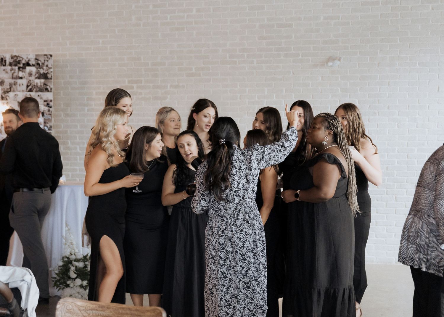 Photographer directs group of friends for group photograph at Tire Shack Brewery summer wedding photography Moncton New Brunswick wedding
