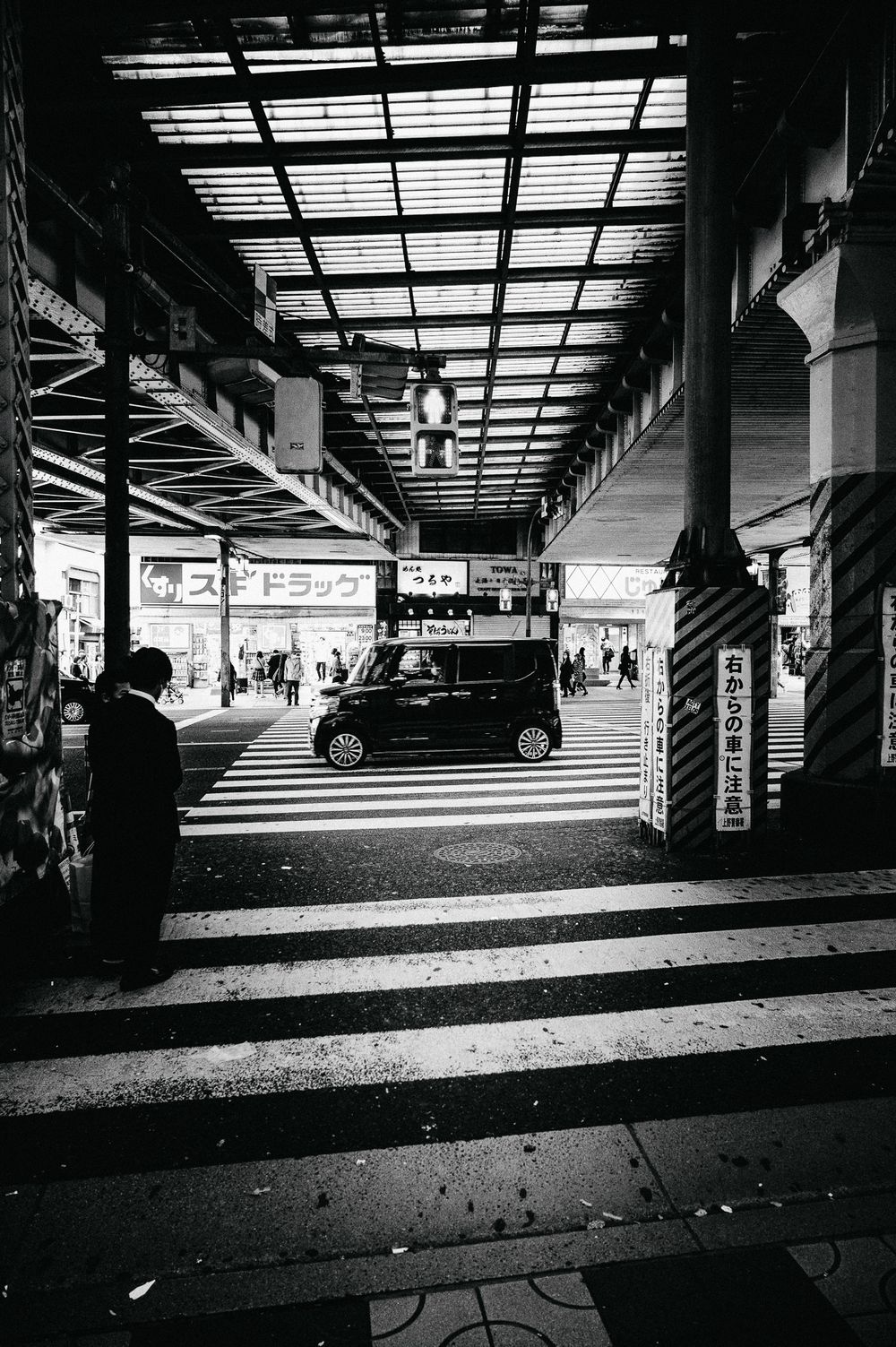 Black and white panoramic series of urban underpasses showing multiple dramatic angles and shadows.