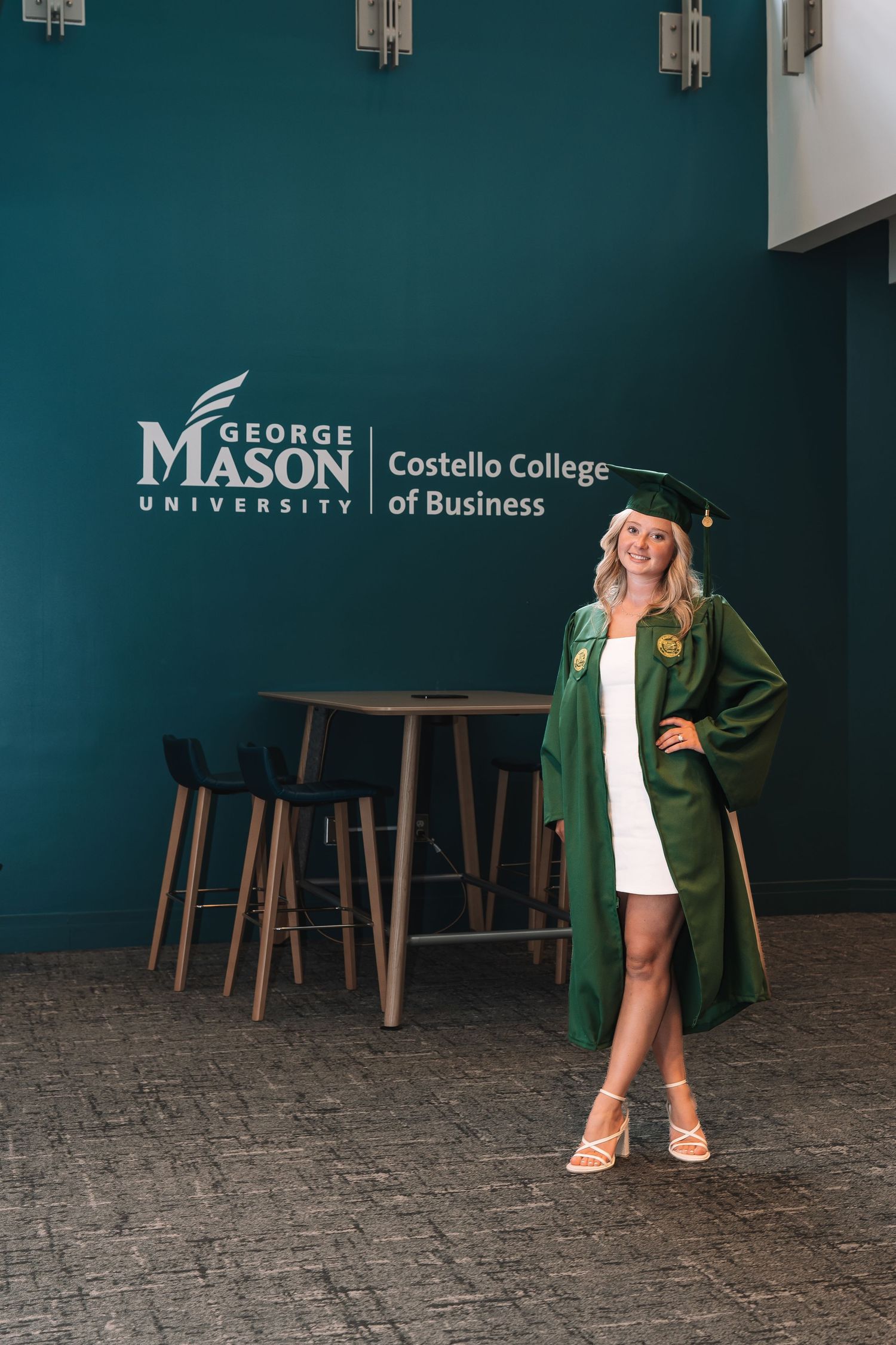 George Mason University graduation portrait in green cap and gown | Northern Virginia senior photos by Alina Phillips Photography