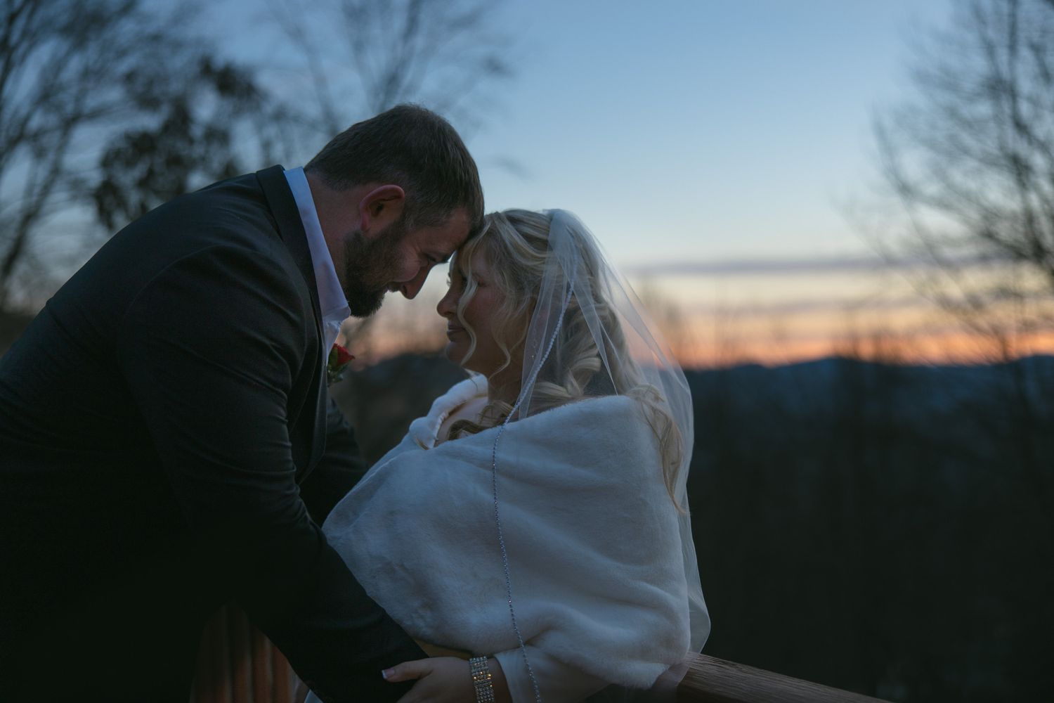 romantic newly wed couple posing at their mountain airbnb during elopement ceremony in WNC