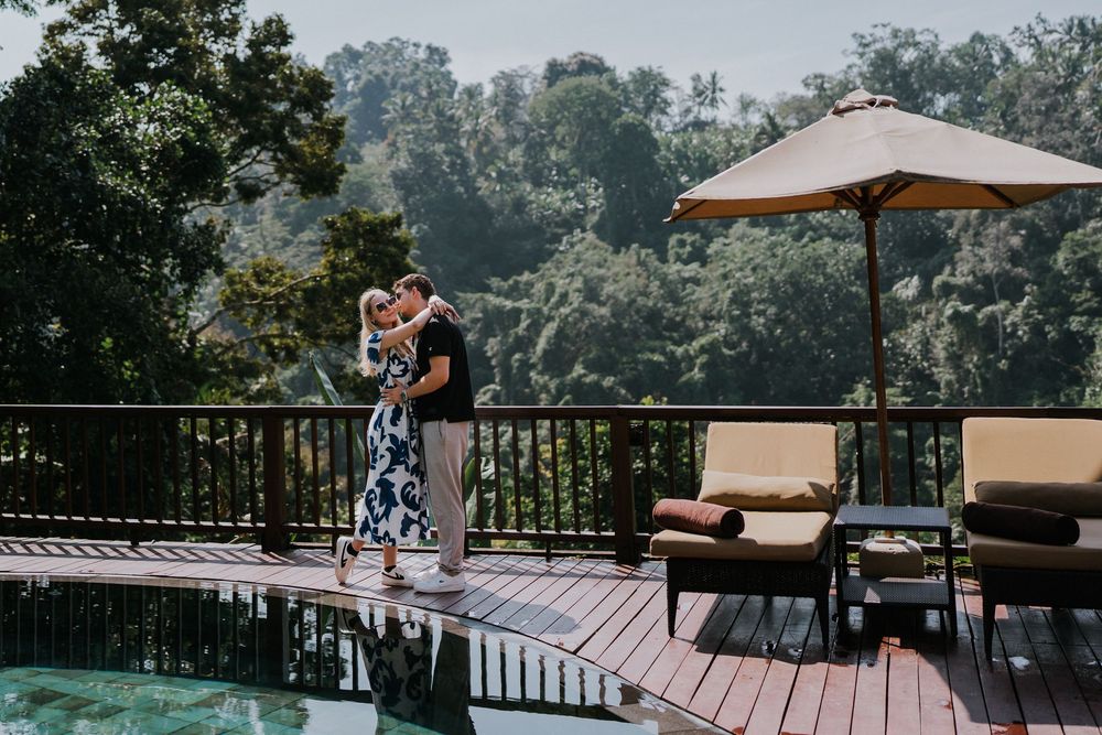 Couple enjoying a moment together on an outdoor patio with mountain views.