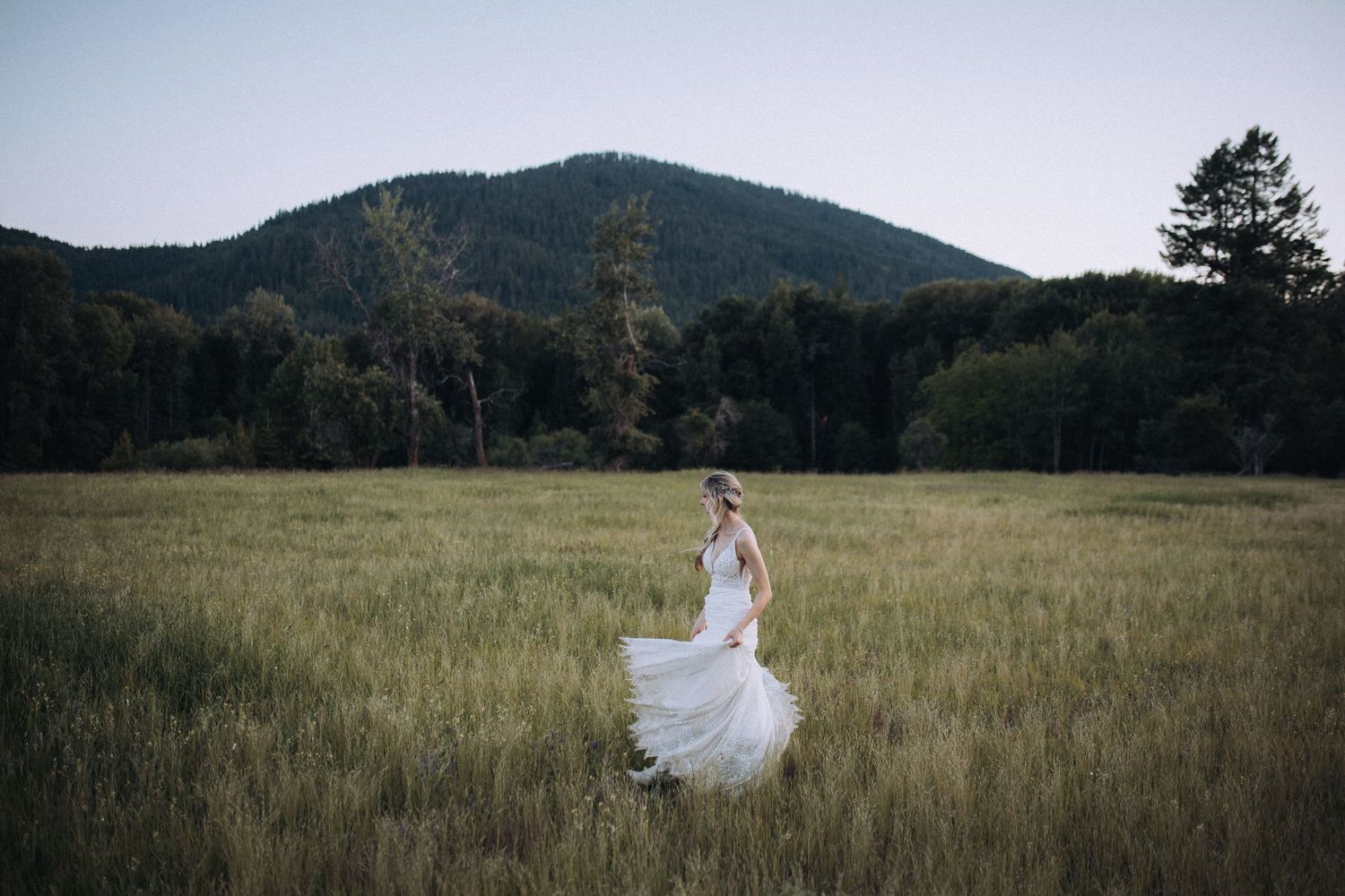 An intimate moment in a wide-open Idaho field during a summer wedding