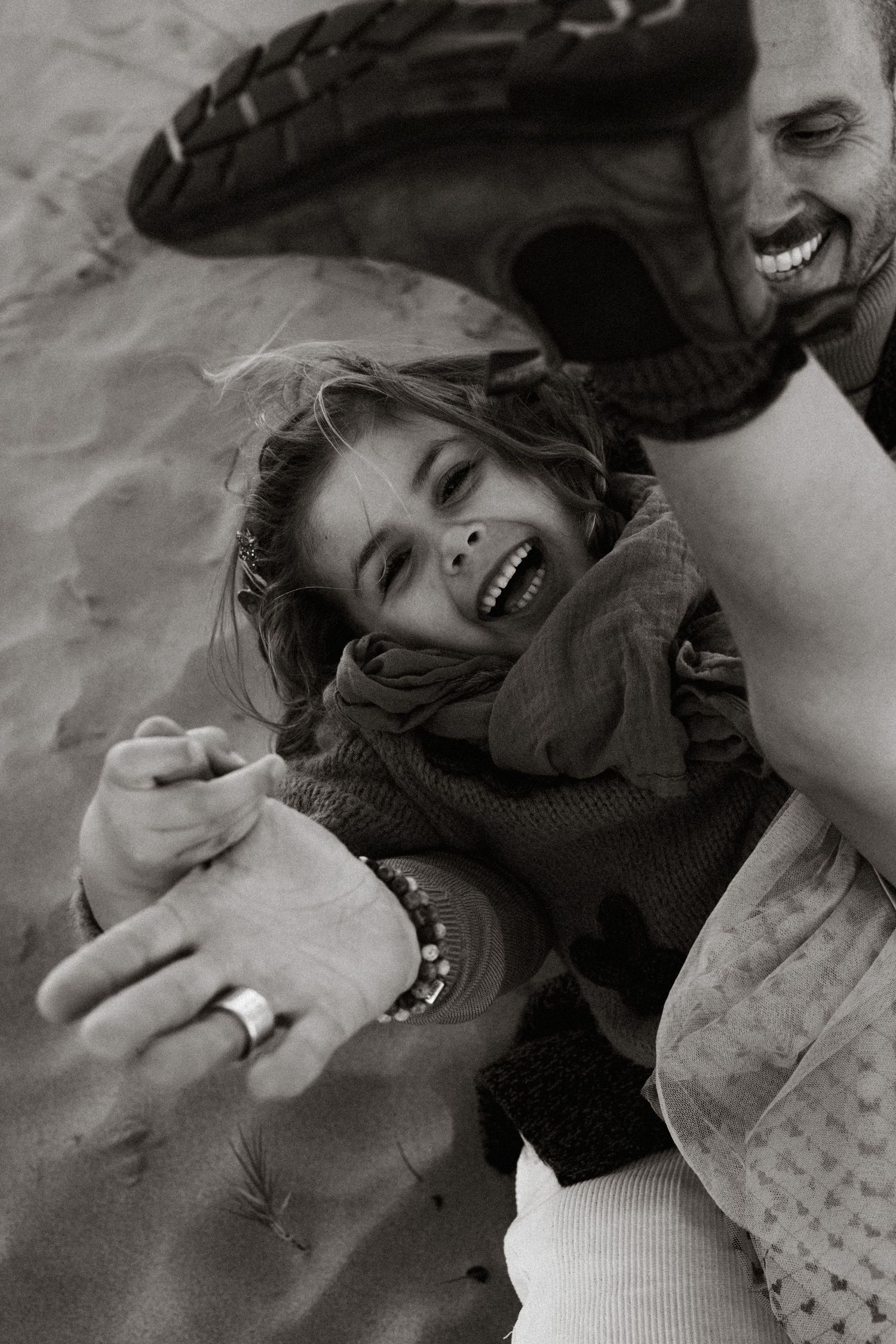 Family photography in Javea showing authentic connection  a father holding his child close with tenderness.