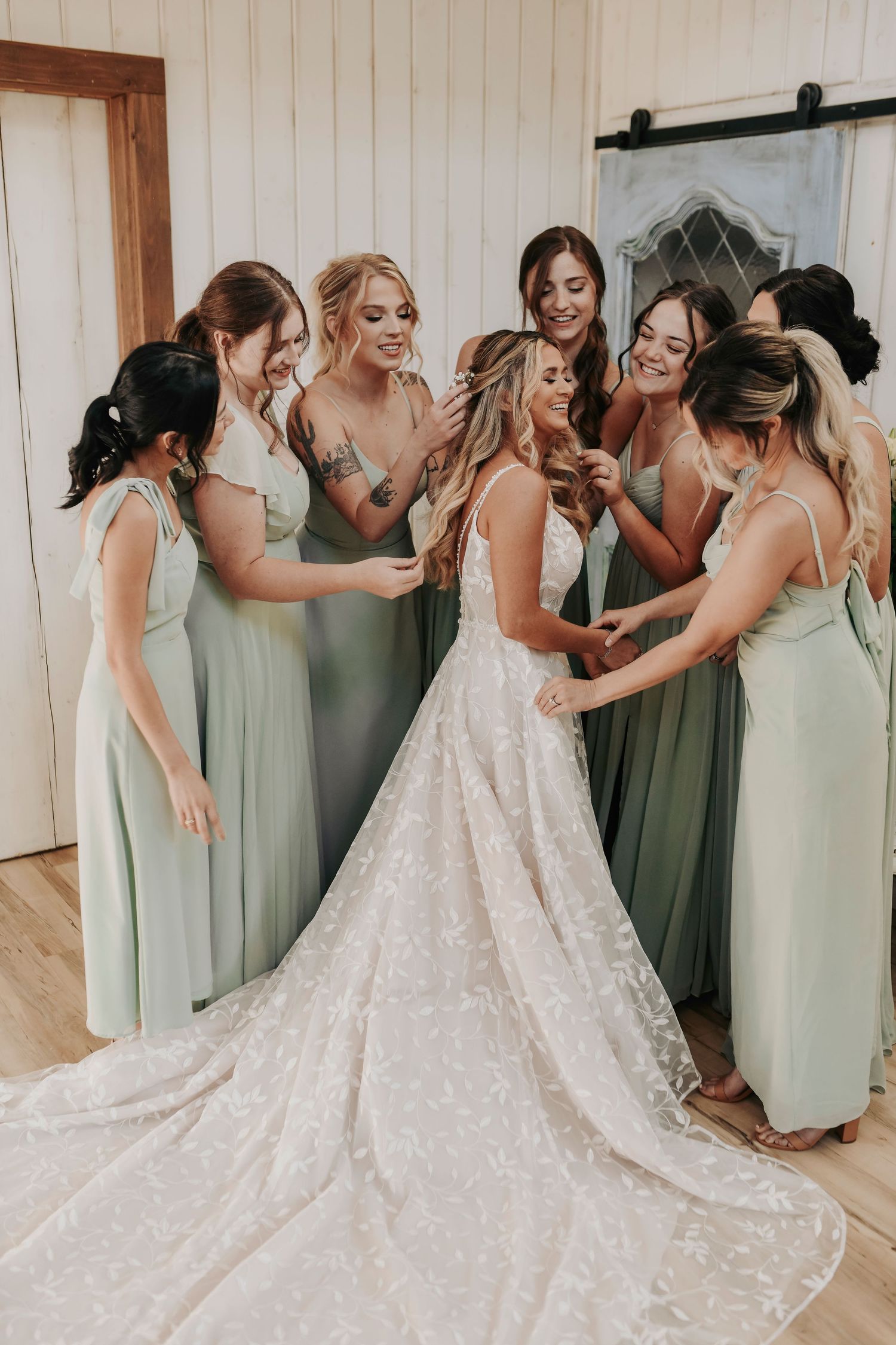 Intimate prayer circle with bride and bridesmaids holding hands